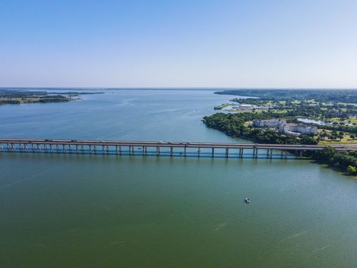 The beautiful aerial view of a bridge over Lake Waco in Texas