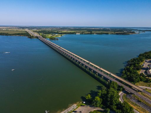The beautiful aerial view of a bridge over Lake Waco in Texas