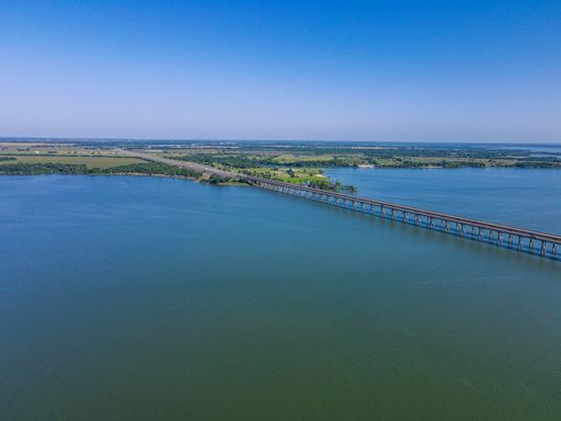 The beautiful aerial view of a bridge over Lake Waco in Texas