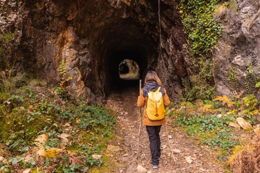 A young girl on the path of the tunnel on Mount Erlaitz in the town of Irun in Basque Country