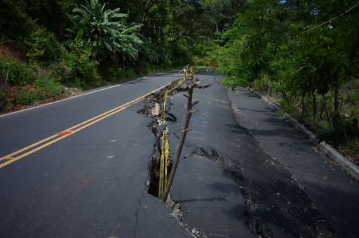 Earthquake-damaged street with a creepy crack in the middle
