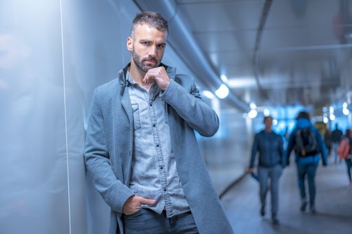 A young Caucasian man in a photoshoot in the city of San Sebastian