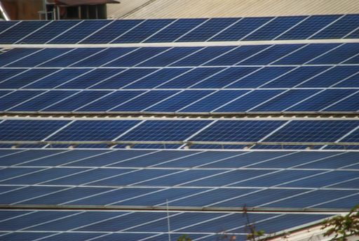 The blue surface of solar panels during daytime