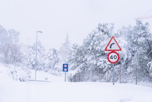 View of a highway in the city covered in snow during heavy snowfall with trapped vehicles. Storm Filomena in Madrid. M-30, Arturo Soria area