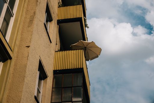 A low angle shot of a building under the cloudy skies