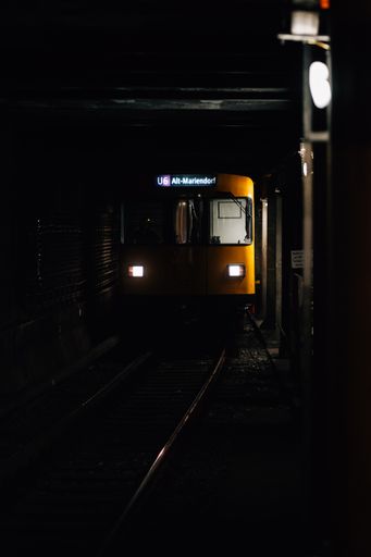 A vertical shot of a train in a dark tunnel