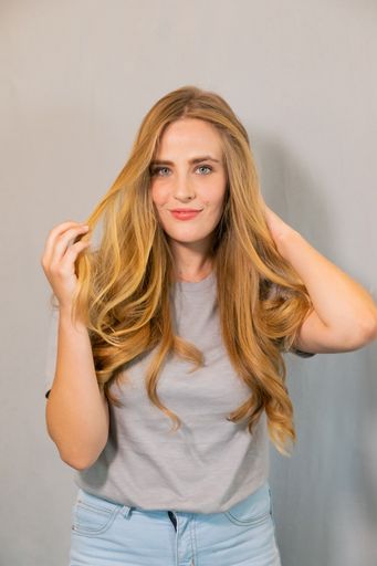 A BTS of a pretty female with a blonde hair model on set in Cape Town, South Africa