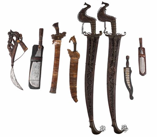 Old vintage weapons under the lights isolated on a white background