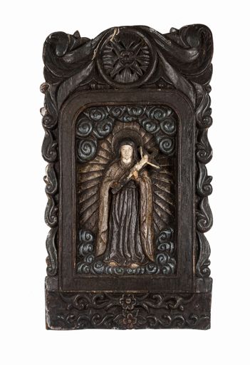 A vertical shot f a carved wood statue of mother Mary holding Jesus isolated on the white background
