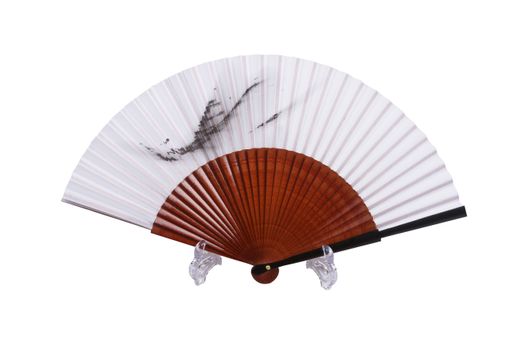 A vintage hand fan under the lights isolated on a white background