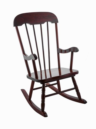 A wooden rocking chair isolated on a white background