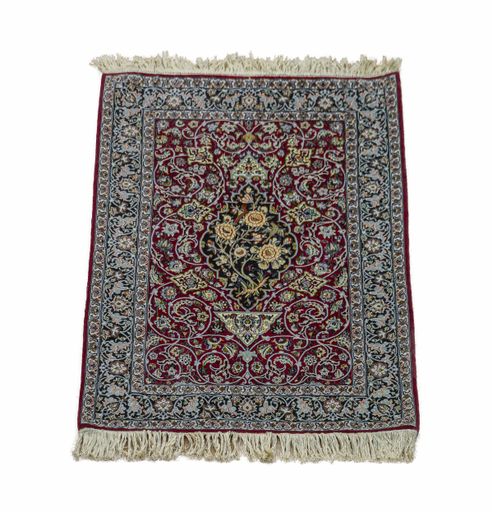 A vertical shot of an old carpet under the lights isolated on a white background