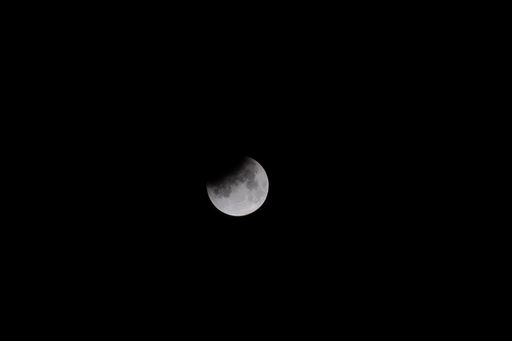 A beautiful view of the moon in the dark night sky