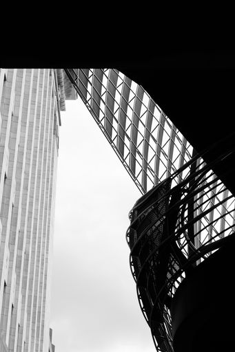 A railing of a bridge in London photographed in black and white