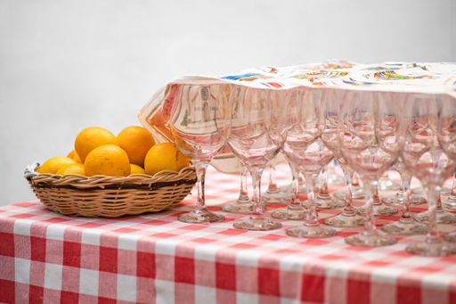 A closeup shot of empty glasses and mandarins