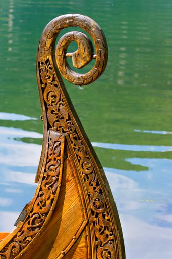 A vertical shot of the details of an old Viking ship on a sunny day in Norway