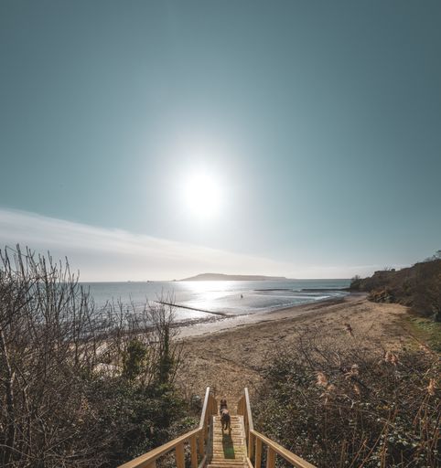 A beautiful shot of the steps leading down to Sandsfoot beach with Portland in the distance, Weymouth