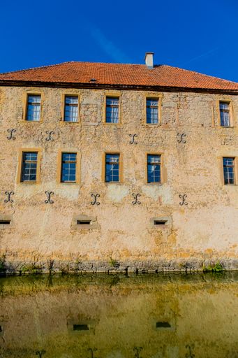 A vertical shot of an old building through the Grabfeld at the gates of Franconia - Thuringia