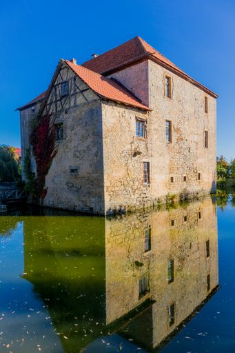 A vertical shot of an old building through the Grabfeld at the gates of Franconia - Thuringia
