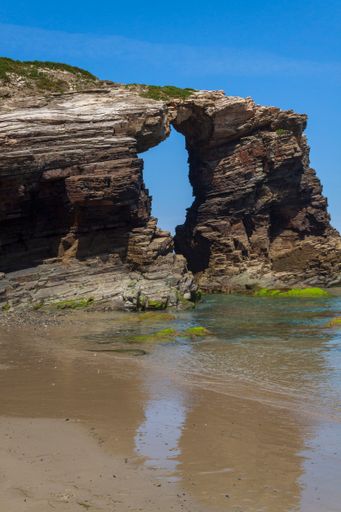A vertical shot of a rocky formation at the Beach of the Cathedrals in Lugo, Galicia. Spain