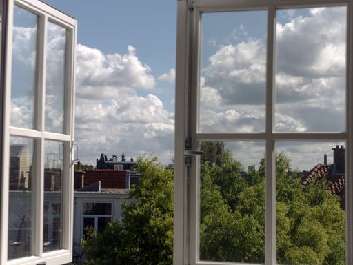 A beautiful view of a village from a white panel window