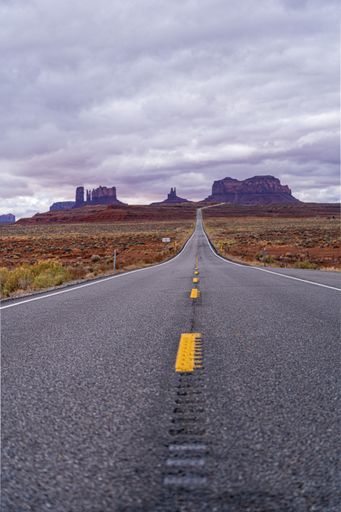 A vertical shot of a road in Monument Valley Oljato-Monument USA