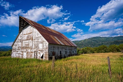 A lone croft house cottage in a rural mountain landscape