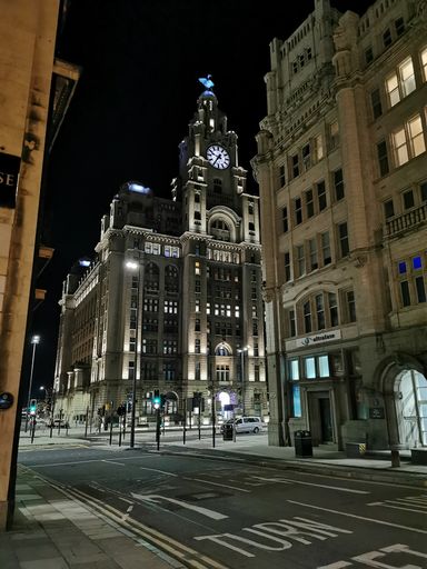 A closeup of the Liver building in Liverpool at night