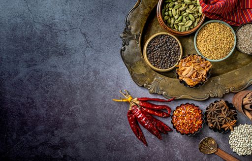 A top view of Indian seasonings and spices on a table