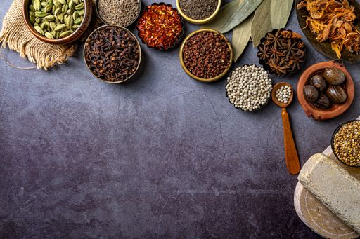 A top view of Indian seasonings and spices on a table