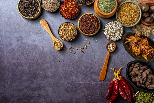 A top view of Indian seasonings and spices on a table