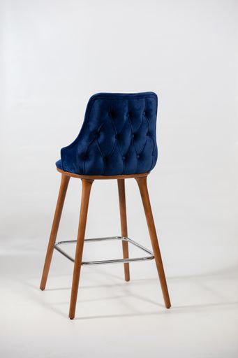 A vertical shot of a blue chair made up of wooden legs