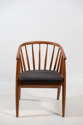 A beautiful shot of a wooden chair isolated on a white background