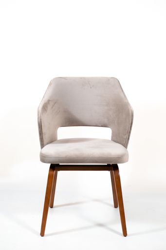 A vertical shot of a white chair with wooden legs behind a white background