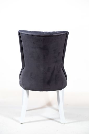 A behind shot of a modern grey armchair isolated on a white background
