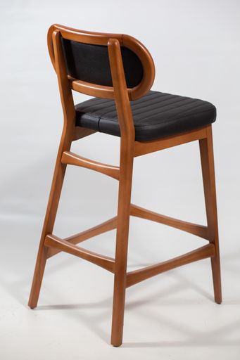 A behind shot of a wooden chair isolated on a white background