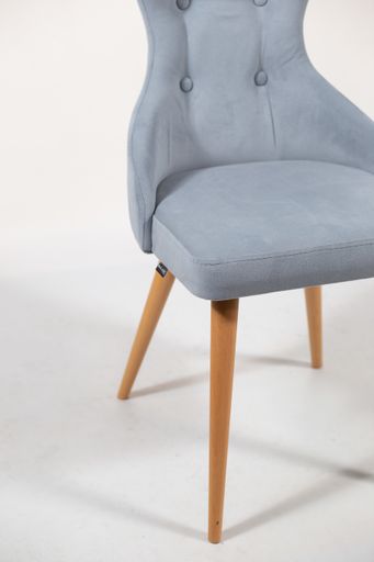 A beautiful shot of a grey wooden chair isolated on a white background
