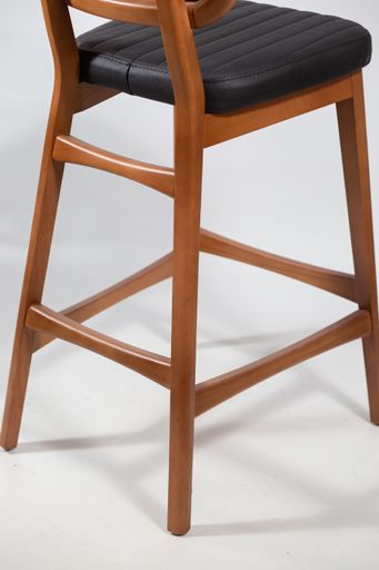 A behind shot of a wooden chair isolated on a white background