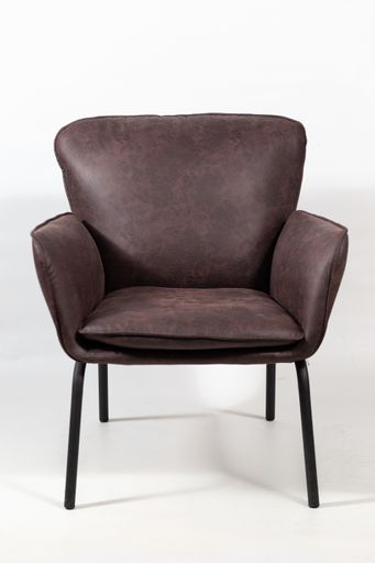 A closeup shot of a dark brown leather armchair