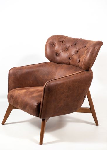 A comfortable leather armchair isolated on a white background