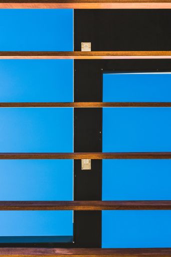 A vertical shot of wooden planks prepared to be used in a construction