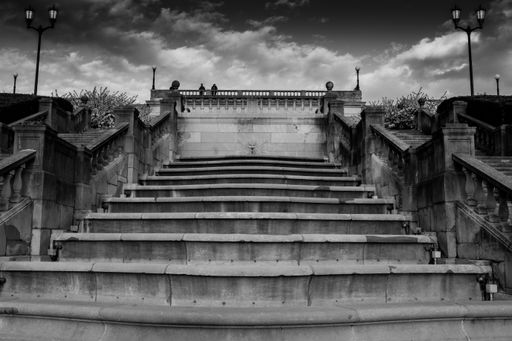 A grayscale shot of the empty stone stairway.