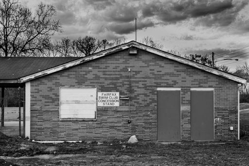 A grayscale shot of an abandoned swim club building in Cincinnati, Ohio