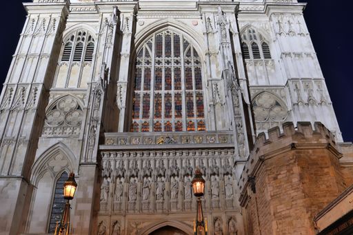 A closeup shot of a mesmerizing church Westminster Abbey in London, England at night