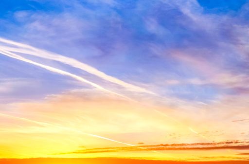 A panoramic shot of a breathtaking colorful cloudy sky at sunset