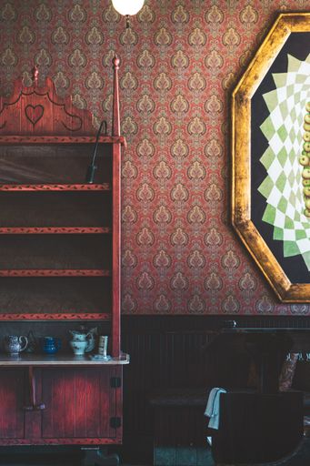 A vertical shot of a vintage interior with vintage furniture