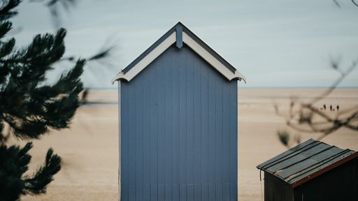 A hut on the beach during a cloudy dark day