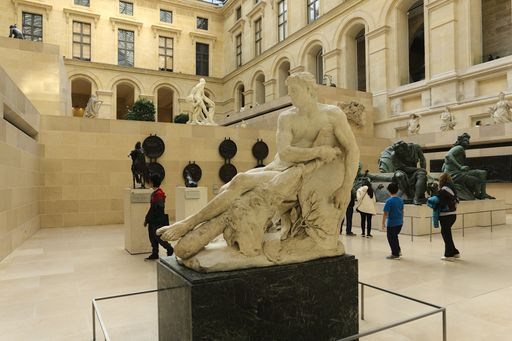 Marble sculpture Gallic Hercules in the Cour Marly courtyard in Richelieu Wing of Louvre Museum in Paris, France
