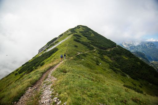 A beautiful shot of a green hill near the Triglav Mountain in Slovenia