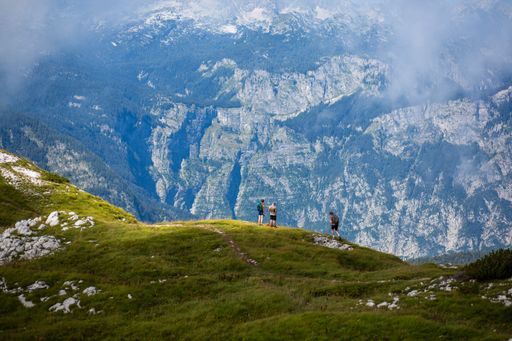 A group of hikers on a trail on Triglav Mountains in Slovenia